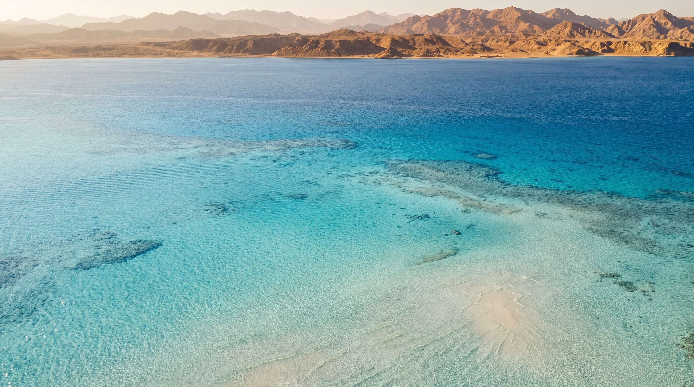 Aerial view of the turquoise reef and coast near Sharm El Maya